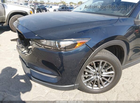 JM3KFACM0K0655670 2019 MAZDA CX-5 Dark Blue Vista interior trasera