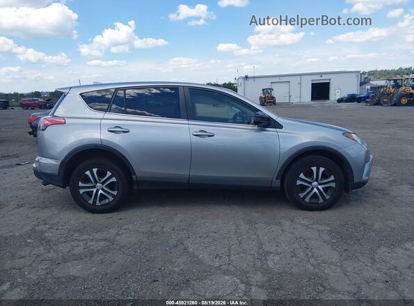 JTMBFREV0JJ198297 2018 TOYOTA RAV4 Silver უკანა სალონის ხედი