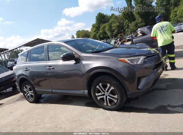 JTMBFREV1JJ746372 2018 TOYOTA RAV4 Gray Vista interior trasera