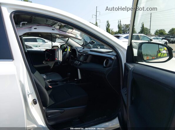 JTMBFREV4GJ059671 2016 TOYOTA RAV4 White Front interior view