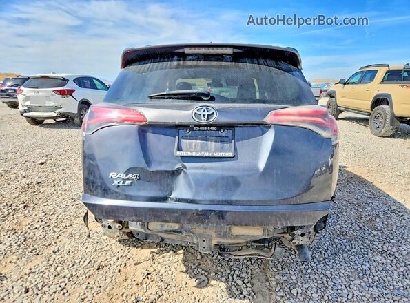 JTMBFREV4HJ707852 2017 TOYOTA RAV4 Gray Rear view