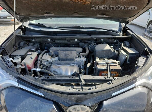 JTMBFREV4HJ707852 2017 TOYOTA RAV4 Gray Rear interior view