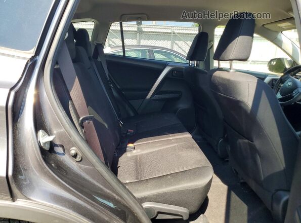 JTMBFREV7JJ213068 2018 TOYOTA RAV4 Gray Vista interior trasera