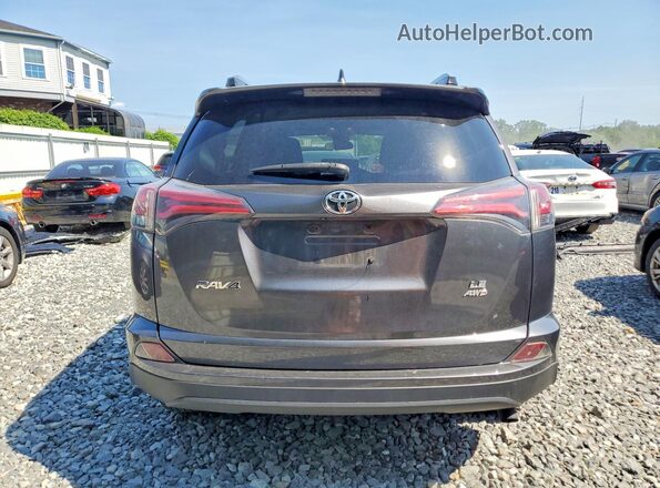 JTMBFREV7JJ213068 2018 TOYOTA RAV4 Gray Vista trasera