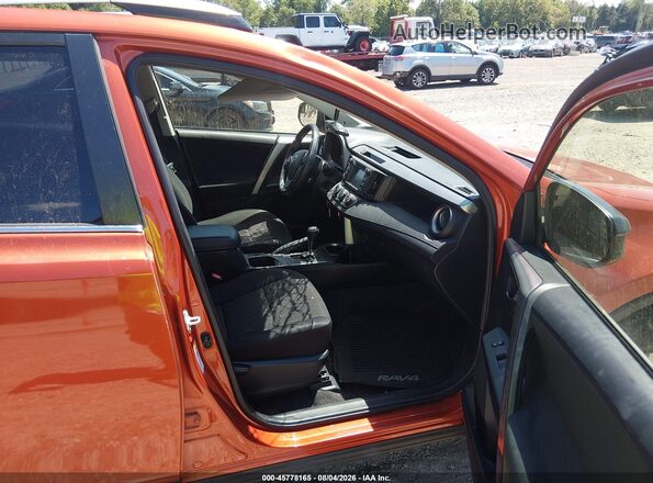 JTMBFREV8GJ099414 2016 TOYOTA RAV4 Оранжевый Вид салона спереди