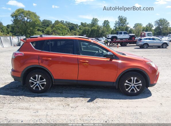 JTMBFREV8GJ099414 2016 TOYOTA RAV4 Оранжевый Вид задней части салона