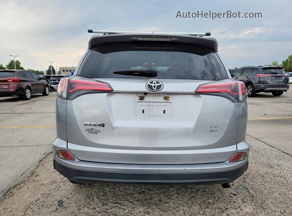 JTMBFREV9JJ257475 2018 TOYOTA RAV4 Silver Vista trasera