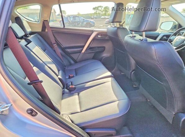 JTMDFREV0JJ214362 2018 TOYOTA RAV4 Silver Rear interior view