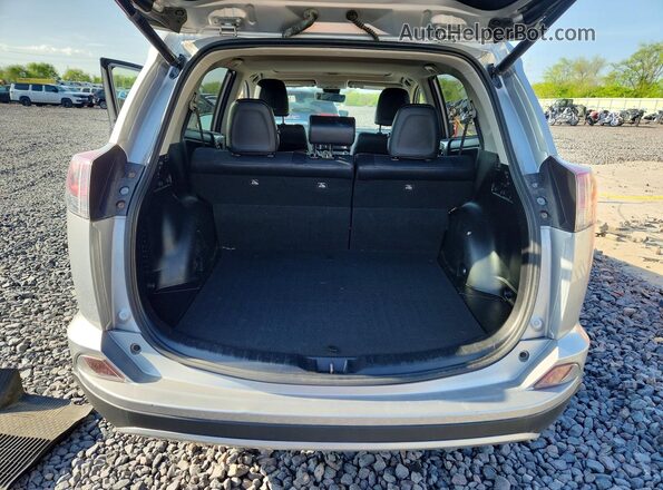 JTMDFREV0JJ214362 2018 TOYOTA RAV4 Silver Rear view