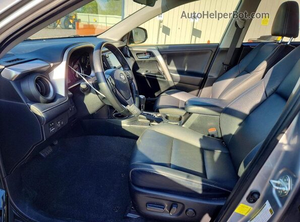JTMDFREV0JJ214362 2018 TOYOTA RAV4 Silver Front interior view