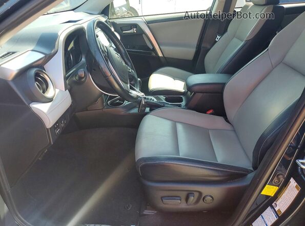 JTMDFREV4HJ704121 2017 TOYOTA RAV4 Blue Front interior view