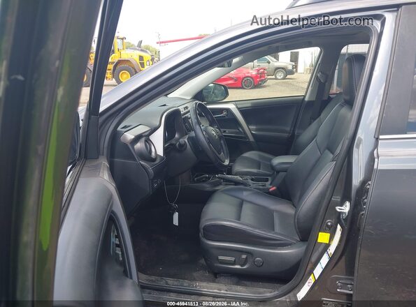 JTMDFREV8JJ722806 2018 TOYOTA RAV4 Gray Front interior view