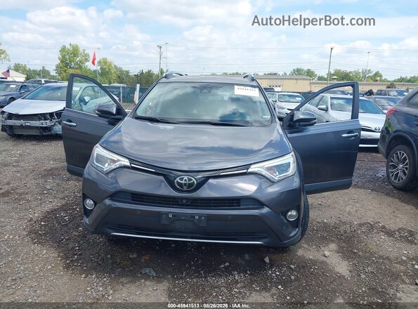 JTMDFREV8JJ722806 2018 TOYOTA RAV4 Gray Front view