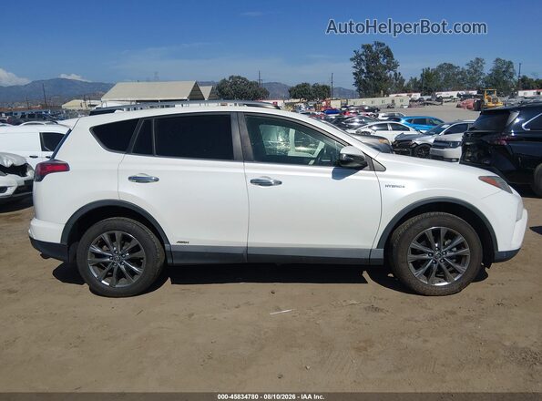 JTMDJREV0JD192652 2018 TOYOTA RAV4 HYBRID White Widok wnętrza z tyłu