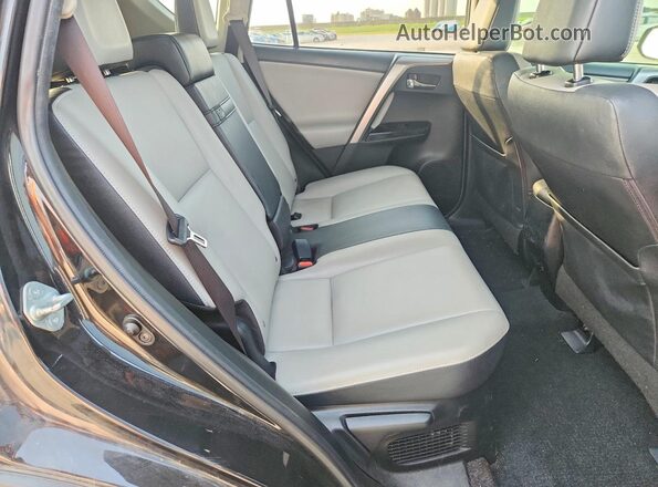 JTMDJREV7GD025942 2016 TOYOTA RAV4 Black Widok tylnych siedzeń