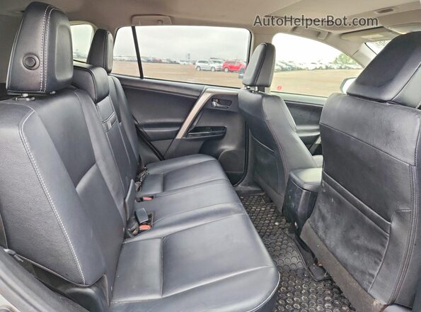 JTMDJREV7JD201444 2018 TOYOTA RAV4 Silver Rear interior view