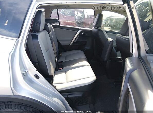 JTMDJREV9GD026137 2016 TOYOTA RAV4 HYBRID Silver Widok naklejki z numerem VIN