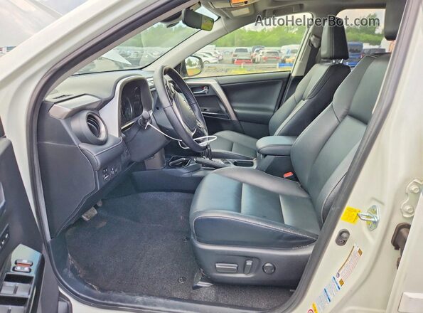 JTMDJREVXGD028706 2016 TOYOTA RAV4 White Front interior view