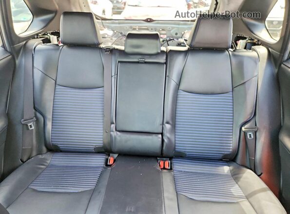 JTME6RFV9PJ032803 2023 TOYOTA RAV4 White Vista de los asientos traseros