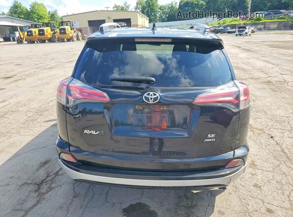 JTMJFREV0GJ077192 2016 TOYOTA RAV4 Black Rear view