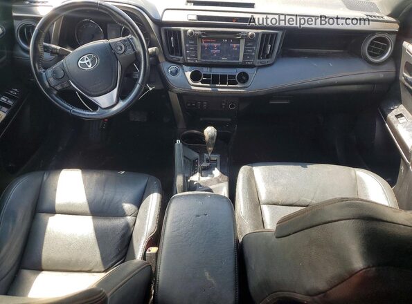 JTMJFREV8GJ077814 2016 TOYOTA RAV4 White Dashboard view