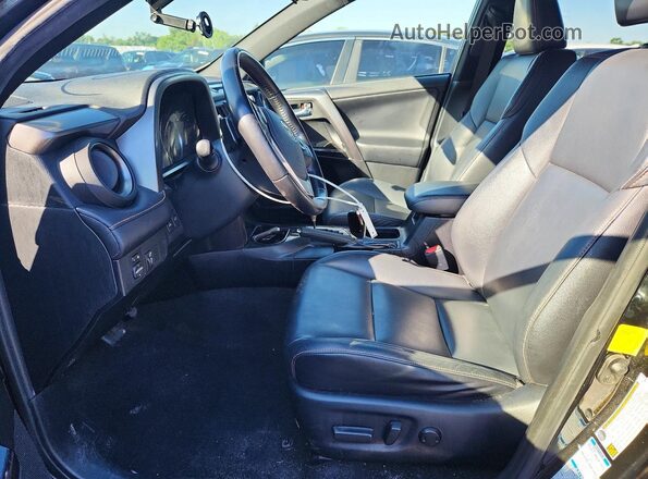 JTMJFREVXGD180568 2016 TOYOTA RAV4 Black Widok wnętrza z przodu