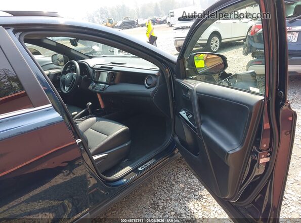 JTMJJREV4JD252967 2018 TOYOTA RAV4 HYBRID Black Front interior view