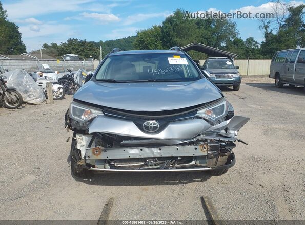 JTMRFREV0JJ242863 2018 TOYOTA RAV4 Gray Rear interior view