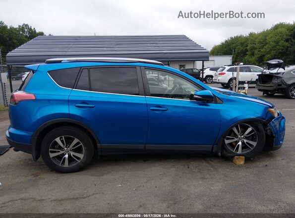 JTMRFREV2HJ714619 2017 TOYOTA RAV4 Black Rear interior view