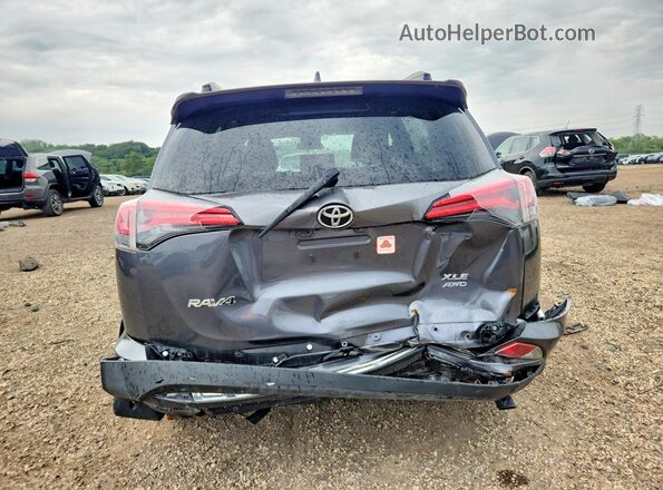 JTMRFREV8JD234802 2018 TOYOTA RAV4 Gray Rear view