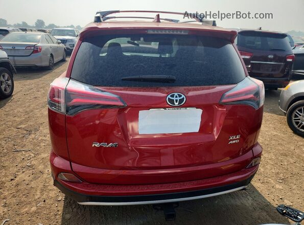 JTMRFREV9GJ086136 2016 TOYOTA RAV4 Red Vista trasera