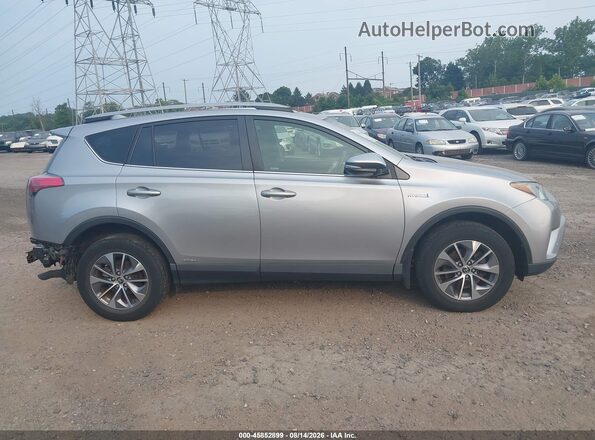 JTMRJREV0JD208645 2018 TOYOTA RAV4 HYBRID Silver Rear interior view
