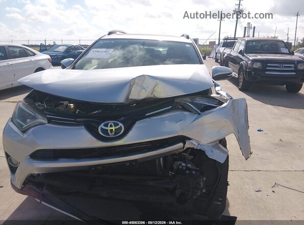 JTMRJREV4GD054983 2016 TOYOTA RAV4 HYBRID Gray Widok z przodu