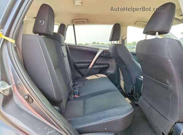 JTMRJREV6JD189390 2018 TOYOTA RAV4 Gray Vista interior trasera