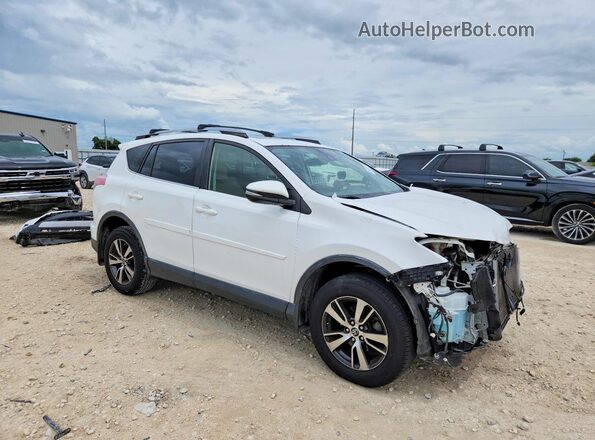 JTMWFREV0HD097318 2017 TOYOTA RAV4 White Front right