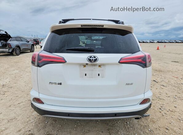 JTMWFREV0HD097318 2017 TOYOTA RAV4 White Rear view