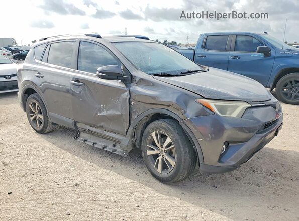 JTMWFREV0HJ700186 2017 TOYOTA RAV4 Gray Front right