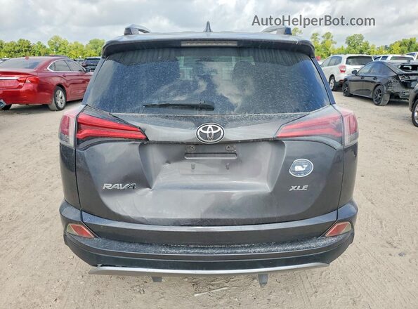 JTMWFREV0HJ700186 2017 TOYOTA RAV4 Gray Rear view