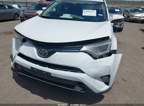 JTMWFREV0JD127715 2018 TOYOTA RAV4 White Front view