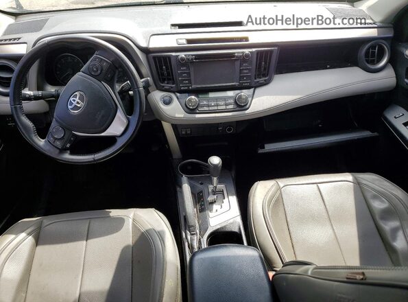 JTMWFREV2JJ179185 2018 TOYOTA RAV4 Silver Widok deski rozdzielczej