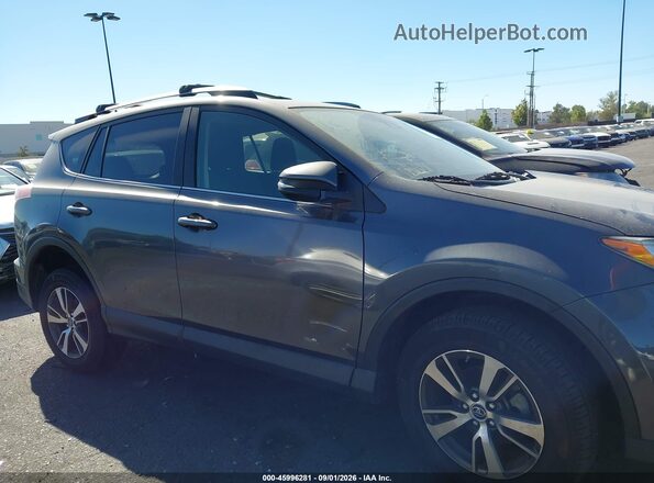 JTMWFREV2JJ740291 2018 TOYOTA RAV4 Gray უკანა სალონის ხედი