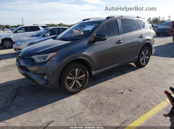 JTMWFREV3HJ701655 2017 TOYOTA RAV4 Gray Vista tres cuartos delantera izquierda