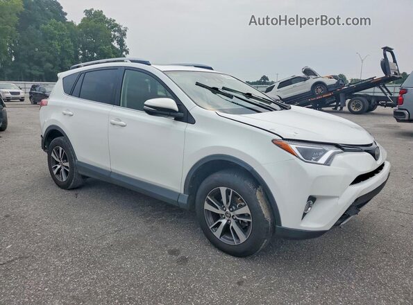 JTMWFREV4HD107168 2017 TOYOTA RAV4 White Front right