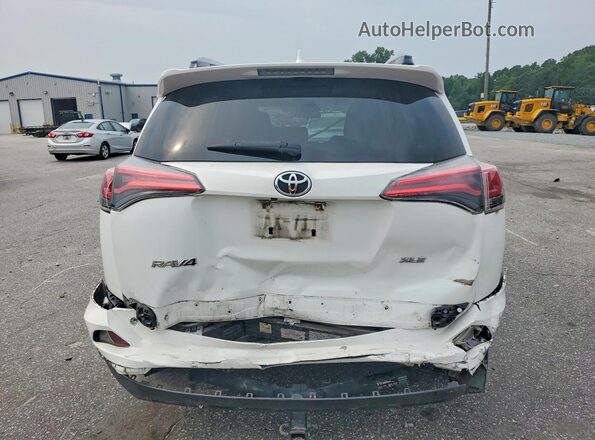 JTMWFREV4HD107168 2017 TOYOTA RAV4 White Rear view