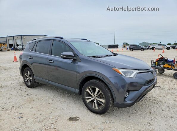 JTMWFREV5HD096214 2017 TOYOTA RAV4 Gray Front right