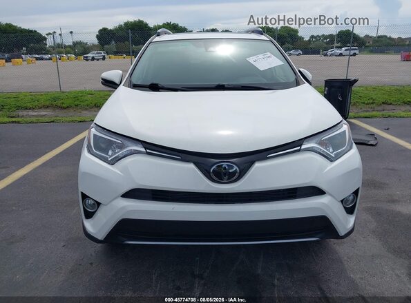 JTMWFREV5JD133610 2018 TOYOTA RAV4 White უკანა სალონის ხედი