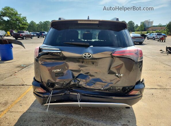 JTMWFREV6JJ153303 2018 TOYOTA RAV4 Gray Rear view