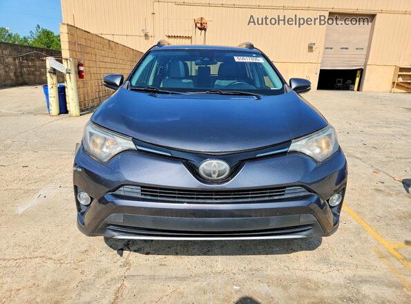 JTMWFREV6JJ153303 2018 TOYOTA RAV4 Gray Front view