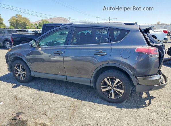 JTMWFREV7GJ075543 2016 TOYOTA RAV4 Gray Rear left