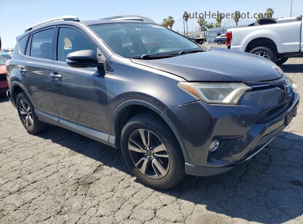 JTMWFREV7GJ075543 2016 TOYOTA RAV4 Gray Front right